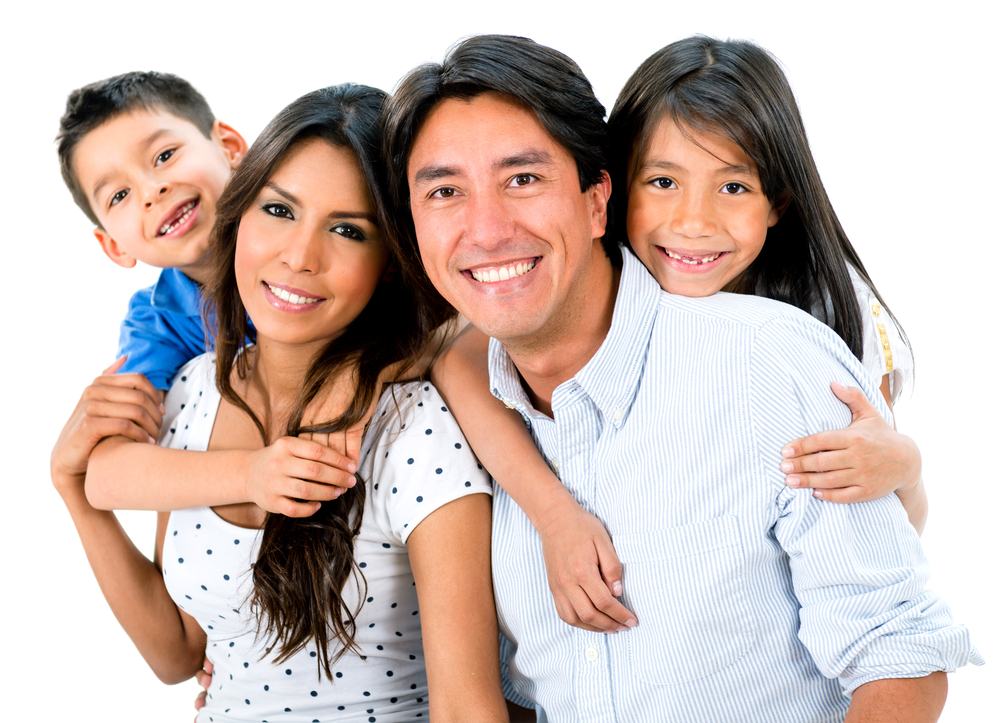 Happy family portrait smiling together - isolated over white background
